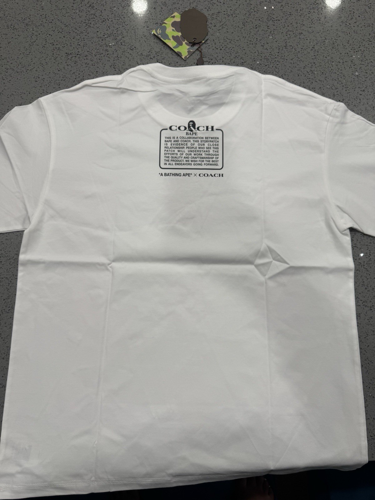 A Bathing Ape x Coach Men’s White Graphic Print Crew Neck Short Sleeve Tee