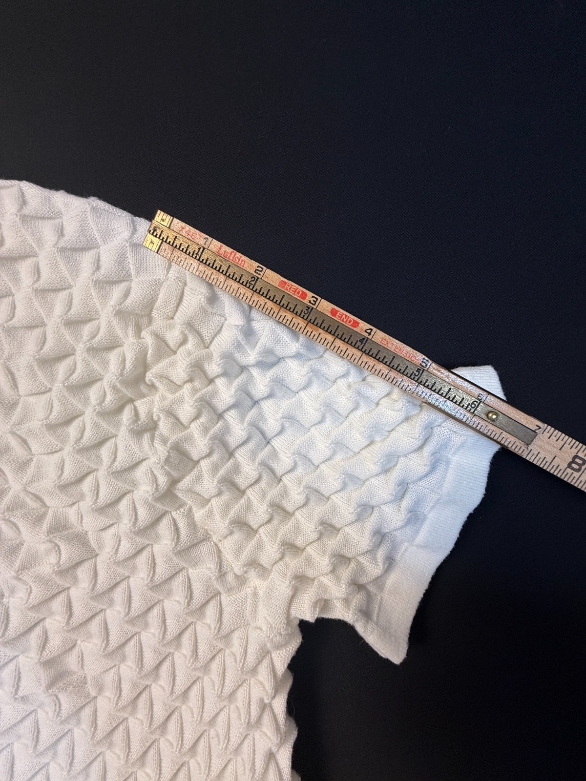 Silversilk textured knit with a raised geometric pattern; white XX (slim)